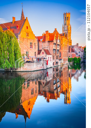 Bruges, Belgium. Rozenhoedkaai in sunrise light, old town with Belfry water reflection 112104057