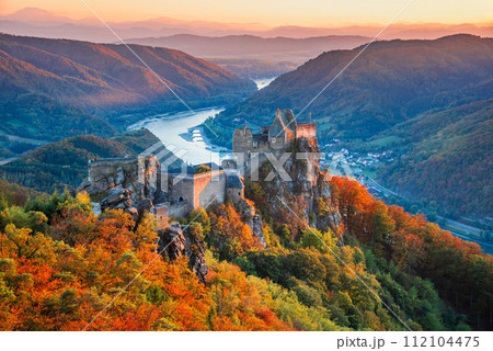 Beautiful landscape with Aggstein castle ruin and Danube River at sunset in Wachau valley Austria. Beautiful landscape with Aggstein castle ruin and Danube River at sunset in Wachau valley Austria. 112104475