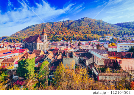 Brasov, Romania. Autumn sunny colors on medieval Transylvania and Carpathian Mountains range. 112104502