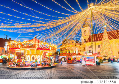 Sibiu, Romania. Christmas Market in Large Square, medieval downtown of Transylvania, famous European Xmas Fair. Sibiu, Romania. Christmas Market in Large Square, medieval downtown of Transylvania, famous European Xmas Fair. 112104530