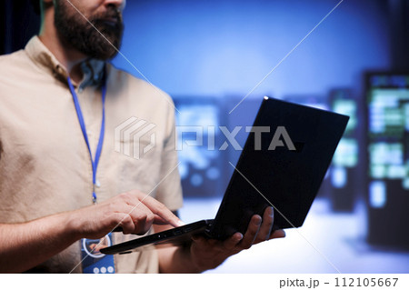 Technical support worker ensuring data center servers are properly equipped to provide redundancy, automatic failover and rapid reconfiguration of clusters to minimize failure of individual machines 112105667