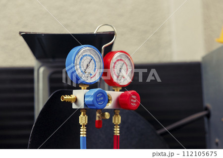 Close up of broken manometers used for checking hvac system freon pressure, in need of servicing. Set of barometer high or low refrigerant levels benchmarking air conditioner component 112105675
