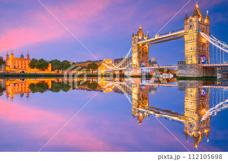 London, England. The Tower and Tower Bridge, river Thames, United Kingdom capital spotlight. 112105698