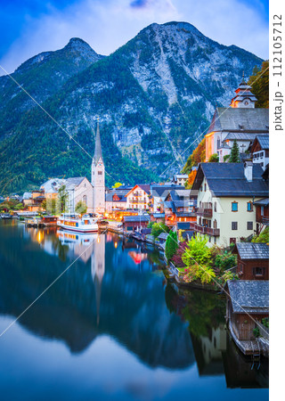Hallstatt, Austria. Small village, misty scenic landscape twilight hour, Austrian Alps. 112105712