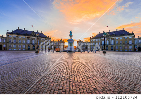 Copenhagen, Denmark. Morning colored sunrise light in Amalienborg Square. Copenhagen, Denmark. Morning colored sunrise light in Amalienborg Square. 112105724