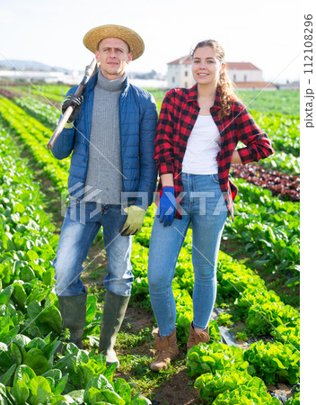Portrait of two farmers on collective farm field Portrait of two farmers on collective farm field 112108296