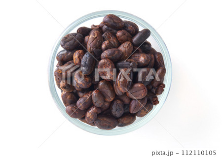 Roasted cocoa beans in a glass bowl Roasted cocoa beans in a glass bowl 112110105