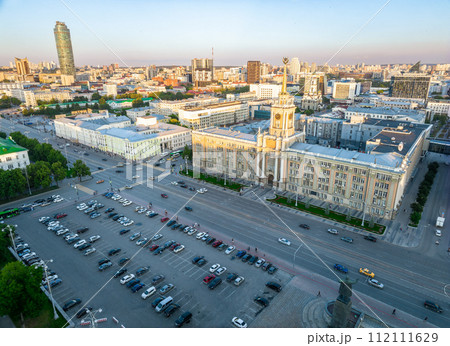 Yekaterinburg City Administration or City Hall and Central square at summer evening. Evening city in the summer sunset, Aerial View. Yekaterinburg City Administration or City Hall and Central square at summer evening. Evening city in the summer sunset, Aerial View. 112111629