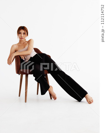 Fashion photo of stylish brunette woman in white 112114752