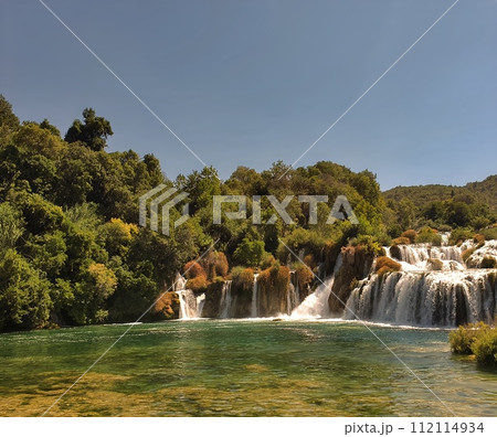 Plitvice National Park, Croatia. Amazing view over the lakes and waterfalls surrounded by forest. Plitvice National Park, Croatia. Amazing view over the lakes and waterfalls surrounded by forest. 112114934