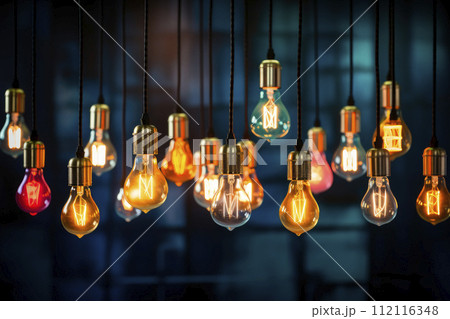 Decorative colored pendant light bulbs. Different shapes of colorful glowing retro lamps hanging on dark background. Decorative colored pendant light bulbs. Different shapes of colorful glowing retro lamps hanging on dark background. 112116348