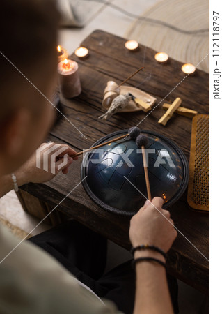 the concept of meditation, relaxation, music for relaxation and aroma sticks the concept of meditation, relaxation, music for relaxation and aroma sticks 112118797