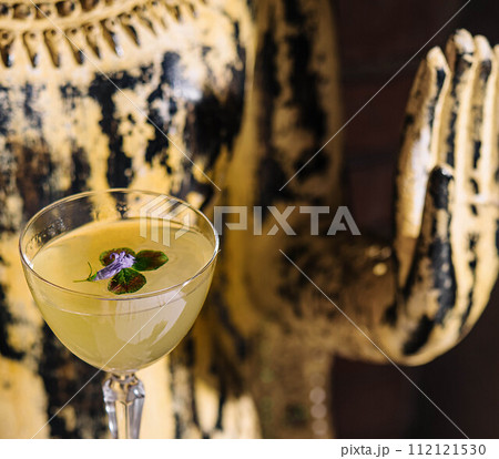 Alcohol cocktail with flower in glass Alcohol cocktail with flower in glass 112121530