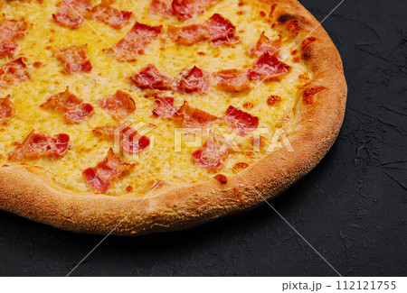 Pizza with bacon and cheese on stone board Pizza with bacon and cheese on stone board 112121755