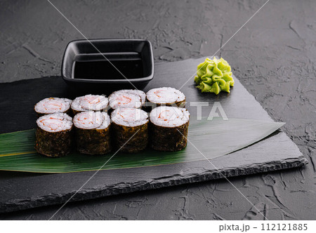Ebi maki - sushi roll with shrimps on black board Ebi maki - sushi roll with shrimps on black board 112121885