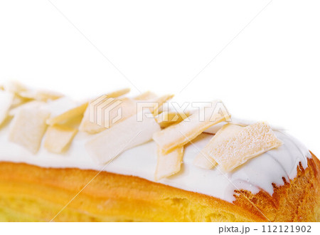 Eclair with white chocolate close up 112121902