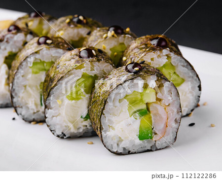 sushi maki with shrimp and cucumbers 112122286