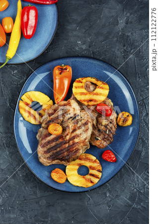 Grilled meat steak with ananas. 112122776