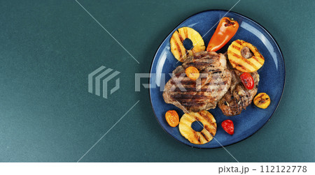 Grilled meat steak with pineapple. 112122778