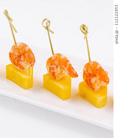 Canapes with shrimp and pineapple on plate Canapes with shrimp and pineapple on plate 112122953