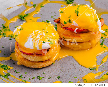 Pancakes with Poached Egg on Plate 112123011