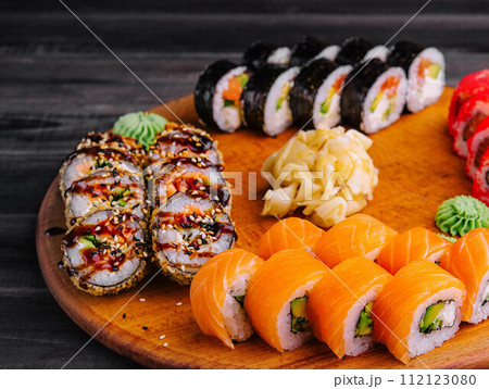 Delicious variety of sushi freshly prepared Delicious variety of sushi freshly prepared 112123080