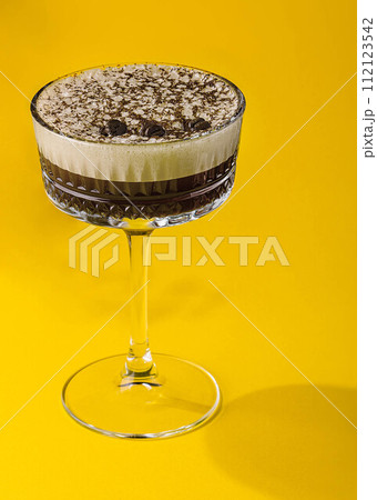 Coffee cocktail with cream and coffee beans Coffee cocktail with cream and coffee beans 112123542