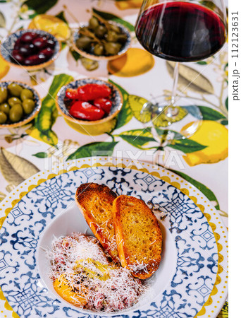 Tasty beef steak tartare with glass of wine Tasty beef steak tartare with glass of wine 112123631