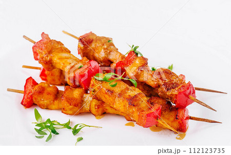 Chicken skewers with slices of sweet peppers 112123735