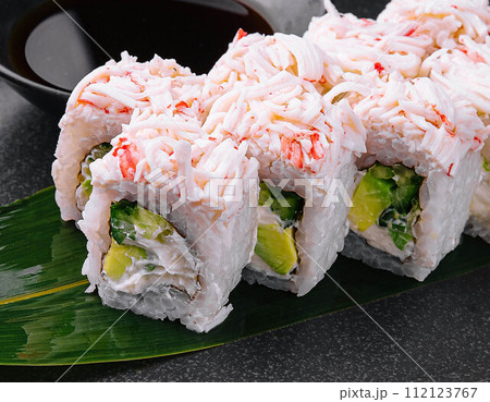 sushi rolls with crab sticks with avocado 112123767