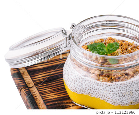 Chia pudding with exotic fruits and granola Chia pudding with exotic fruits and granola 112123960