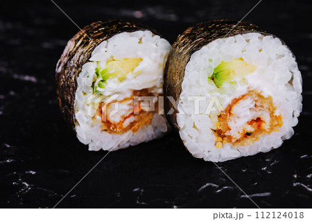 eel hosomaki sushi on natural black background 112124018