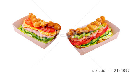 Belgian waffles with salmon, ham, avocado and salad on box Belgian waffles with salmon, ham, avocado and salad on box 112124097