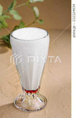 Iced coffee in glass on stone 112124634