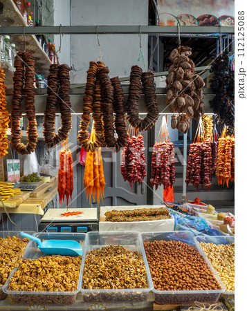 Peeled Georgian nuts. Background of nuts without shells. Snack on the table. Squirrel food. Lots of nuts. Hearty ingredient. Tasty food. Choice of ingredients for cooking. Bundles of figs 112125088