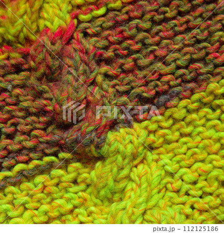 Handmade knitted fabric colored wool background texture Handmade knitted fabric colored wool background texture 112125186