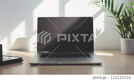 the world of minimalism with a modern laptop, radiating productivity the world of minimalism with a modern laptop, radiating productivity 112125214