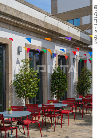 Porto restaurant with San Juan festival flags decorations Porto restaurant with San Juan festival flags decorations 112125588