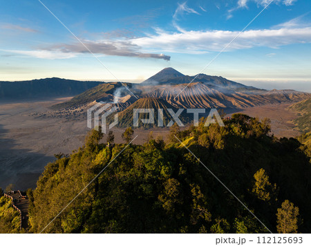 Aerial drone view of Bromo active volcano with Kingkong hill viewpoint, Tengger Semeru national park, East Java, Indonesia Aerial drone view of Bromo active volcano with Kingkong hill viewpoint, Tengger Semeru national park, East Java, Indonesia 112125693