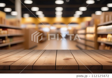Empty table top with supermarket blurred defocused panorama, bokeh light. Backdrop for display or montage products. Blank wood textured counter with blur grocery, market store background. Front view 112125872
