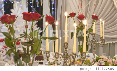 A festively decorated Christmas table. 112127505