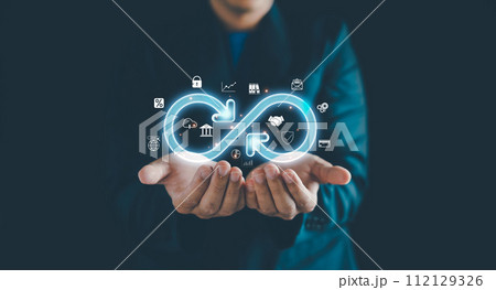 Businessman Hands holding virtual infinity with technology marketing online icon, a symbol of connection to community metaverse world network system and Technology data link concept. Businessman Hands holding virtual infinity with technology marketing online icon, a symbol of connection to community metaverse world network system and Technology data link concept. 112129326