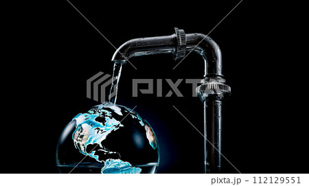 A faucet from which water flows to planet Earth on a black background. A faucet from which water flows to planet Earth on a black background. 112129551