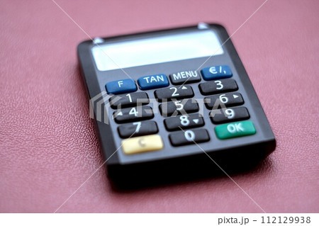 calculator on the red background Security of the TAN number 112129938