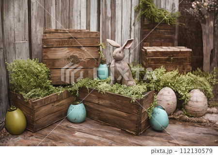 Rustic Easter Charm. A rustic vignette featuring weathered wooden crates Rustic Easter Charm. A rustic vignette featuring weathered wooden crates 112130579
