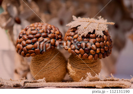 Handmade craft from coffee beans in the form of forest mushrooms. 112131190
