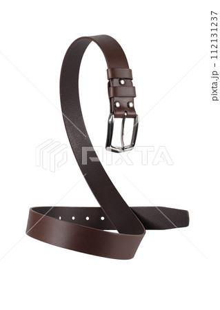 A brown leather belt with a metal buckle is beautifully curved and isolated on a white background. A brown leather belt with a metal buckle is beautifully curved and isolated on a white background. 112131237