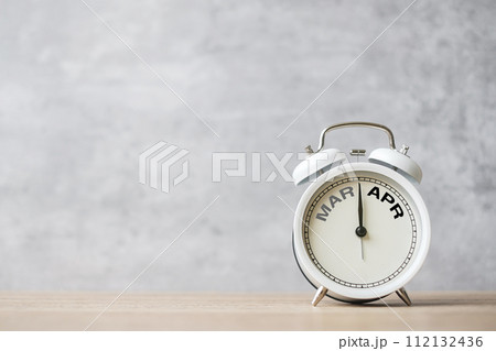 Hello April Changed from March month with vintage alarm clock on table background. Calendar, Monthly, New Start, Resolution, Goals, Plan, Action and Mission Concept 112132436