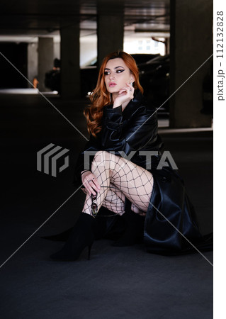 woman in leather coat 112132828