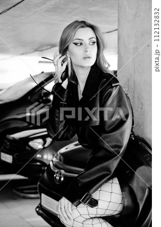 woman in leather coat 112132832